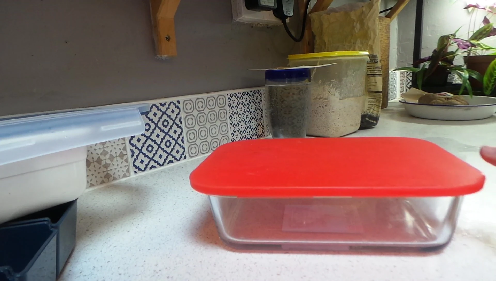 The lunchboxes stored under a shelf, showcasing the under-shelf storage solution.