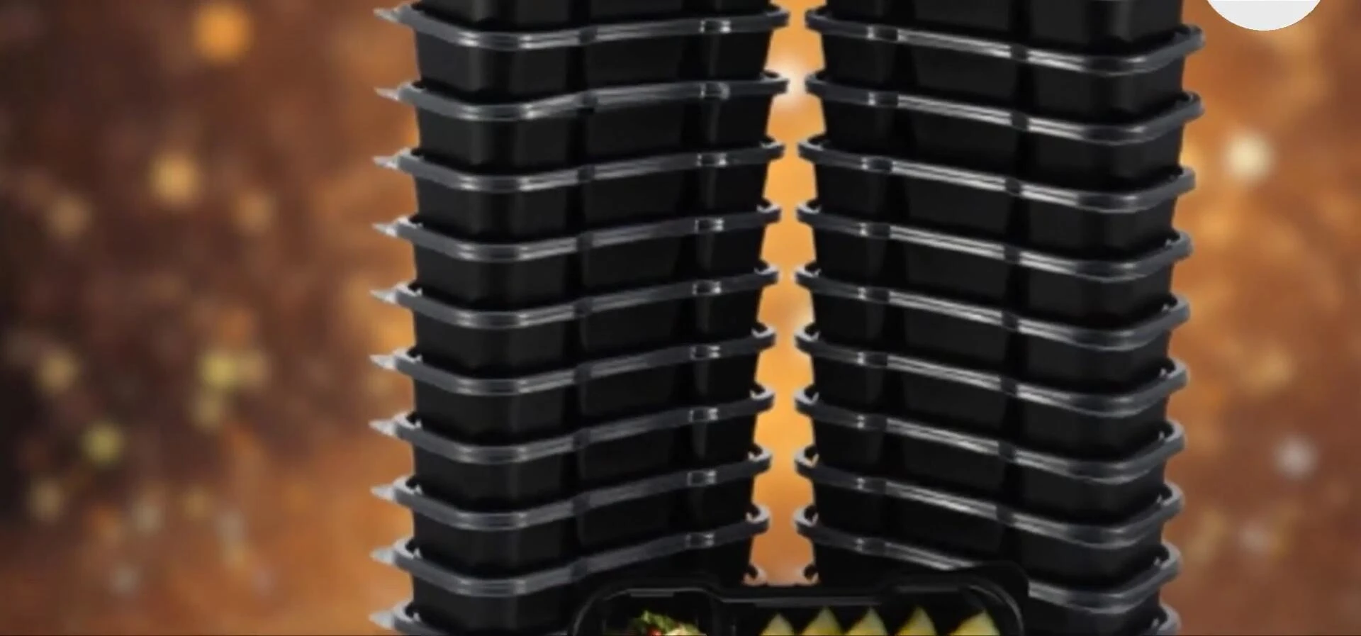Close-up of an Otter bento box with its lid open, showing the compartments.