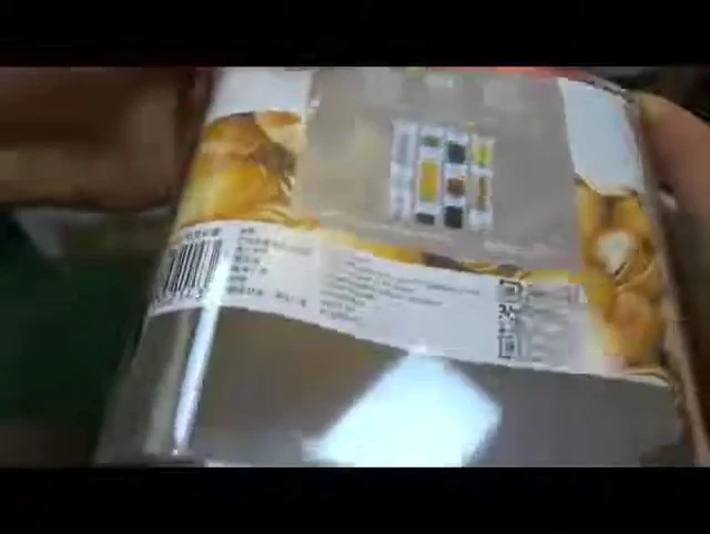 The reviewer showing a stacked container.