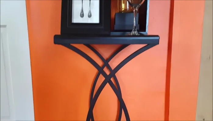 Create a small kitchen decor item beneath the towel rack (optional).