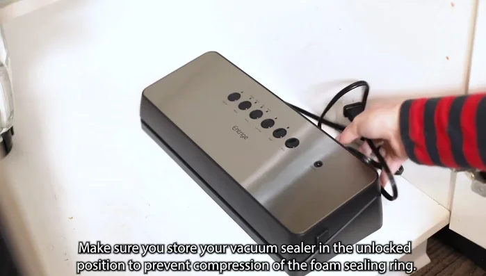 Store the vacuum sealer in the unlocked position to prevent compression of the foam sealing ring.