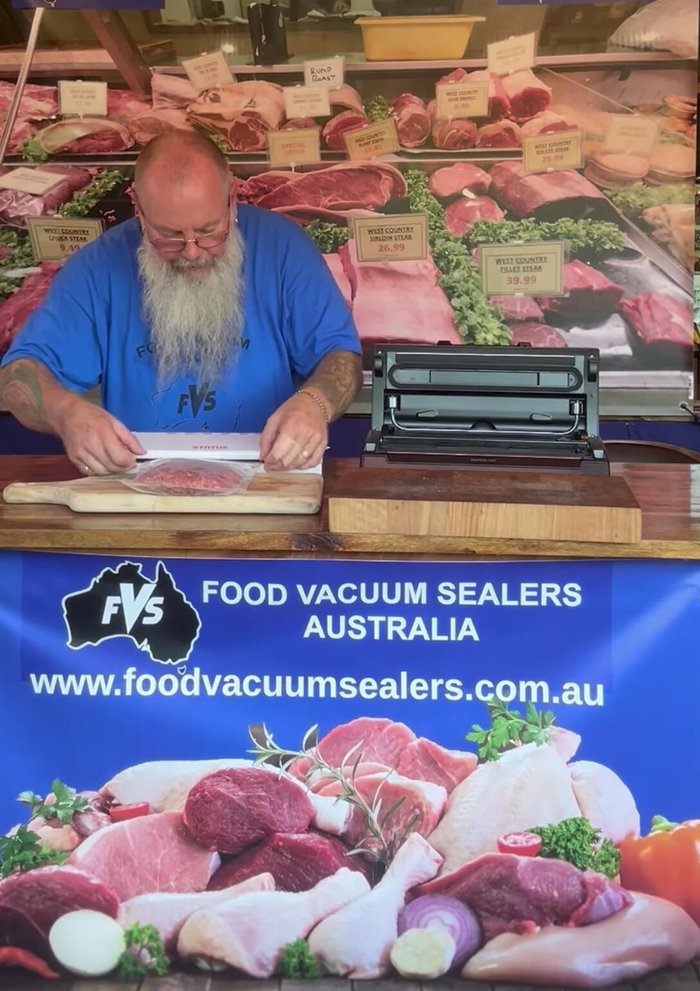 Observe the vacuum process; the machine will draw out air, causing the bag to collapse.