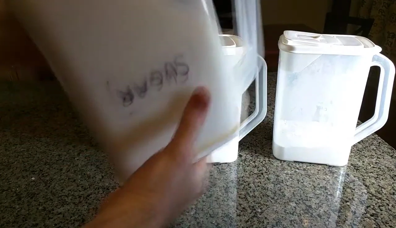 Container shown filled with sugar to demonstrate the seal