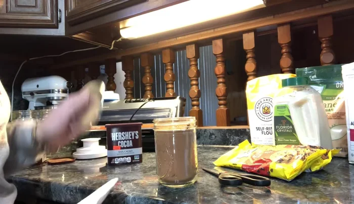 Apply the paper towel filter (if necessary): If using fine powders, create a circle from a paper towel and place it inside the jar, under the lid, to prevent clogging the vacuum sealer.