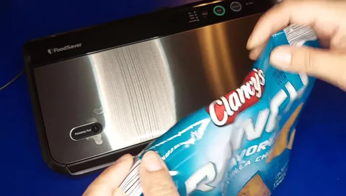 Vacuum sealing opened chips using a smaller pre-cut bag and the 'Seal' function.
