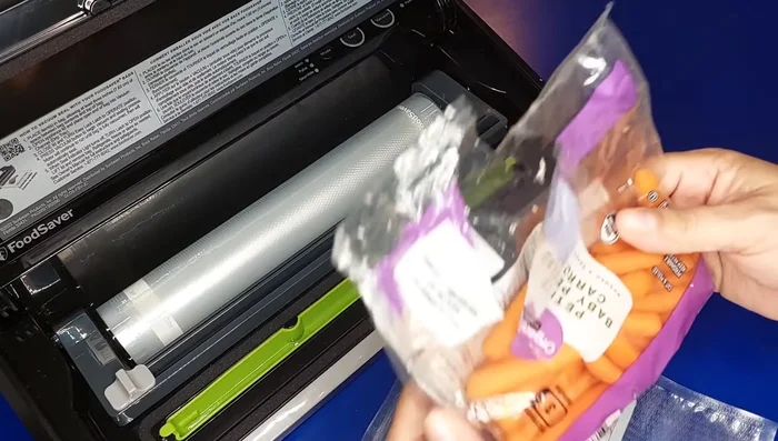 Vacuum sealing moist food (carrots) using the handheld hose attachment and the 'Moist' setting.