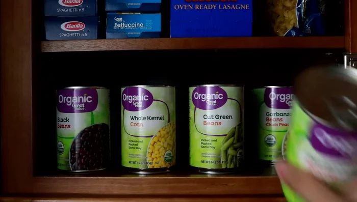 If you don't purchase canned goods frequently, store cans directly on shelves, sliding used cans forward.