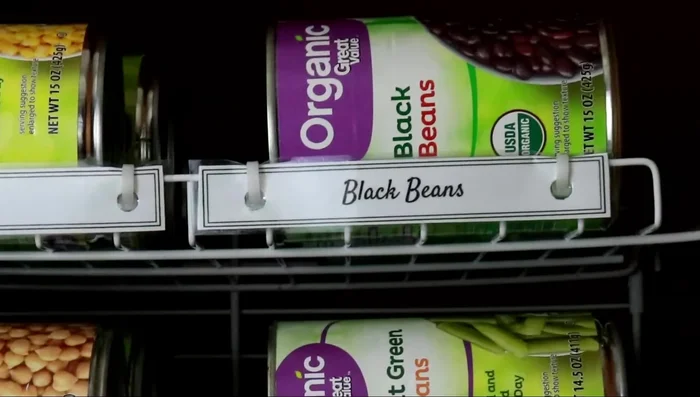 Consider a can dispenser rack if your shelves are too high to easily move cans forward.