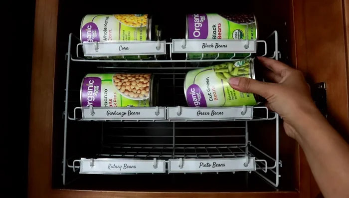 If you don't purchase canned goods frequently, store cans directly on shelves, sliding used cans forward.