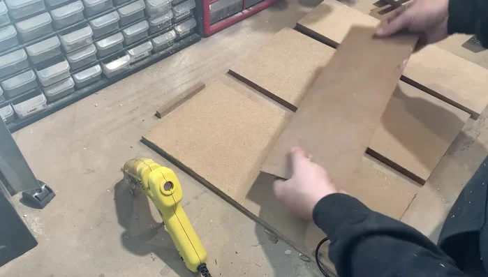 Assemble the Organizer: Begin assembly by attaching one side, the bottom, and the back piece. Leave one side off for easier slide installation.