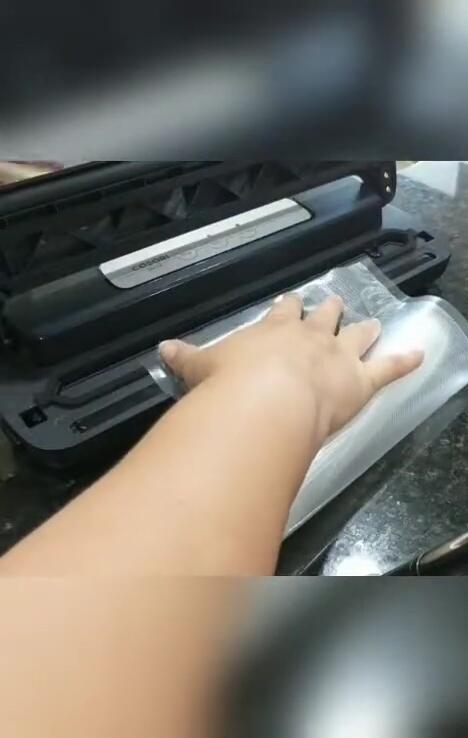 Inserting the bag into the sealer