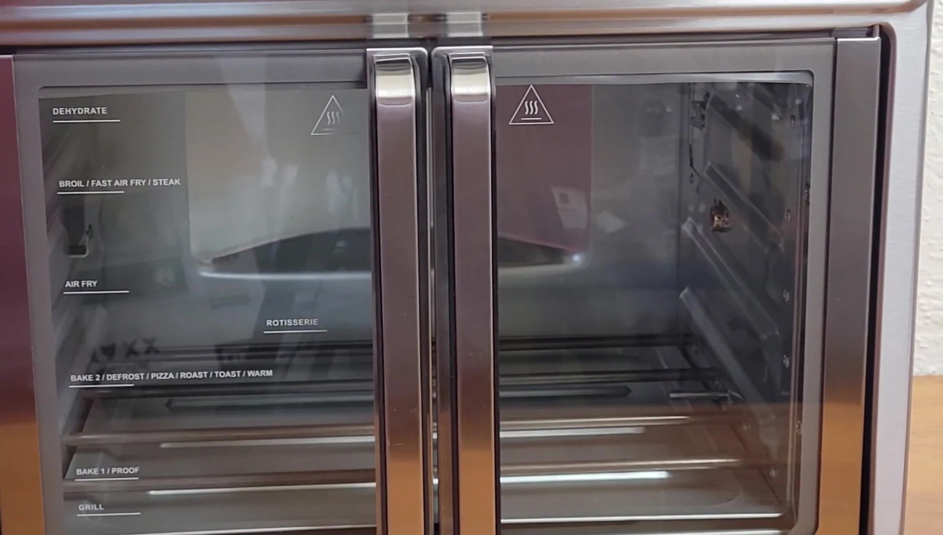 Diagram showing the seven cooking positions of the Kalorik Maxx Air Fryer Oven Grill.