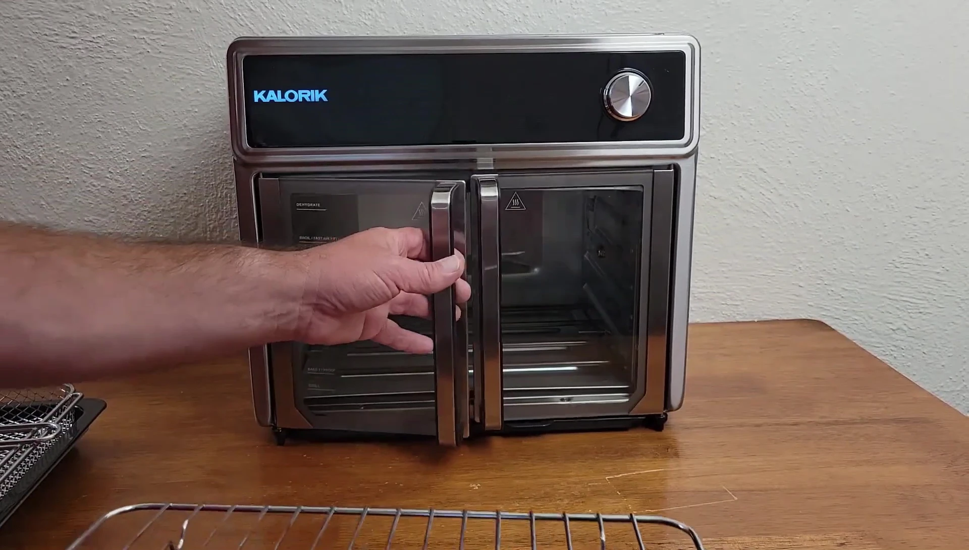 The wire rack shown next to the air fryer basket.