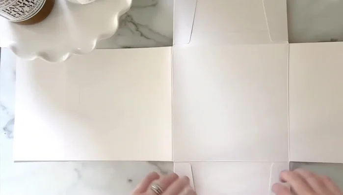 Identify the shiny side (baker box material) and position it outwards.