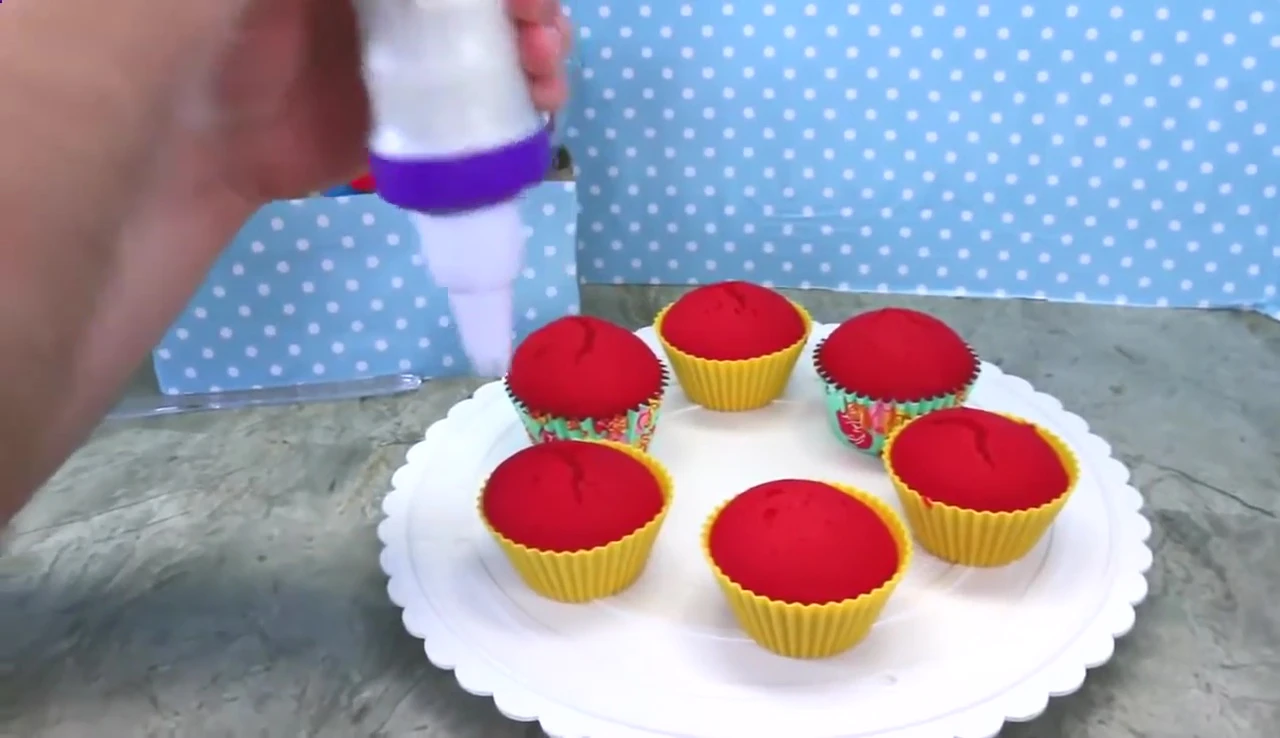 Frosting and decorating the cupcakes.