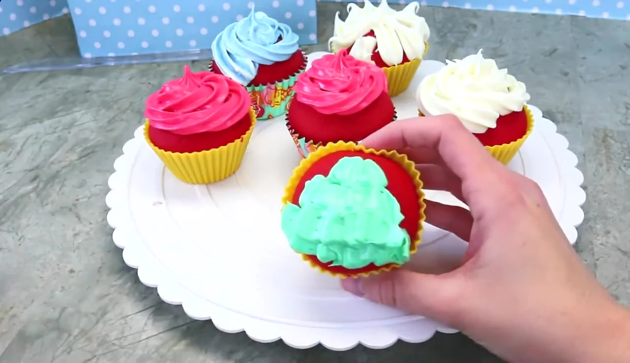 Decorated cupcakes with M&Ms and other decorations.