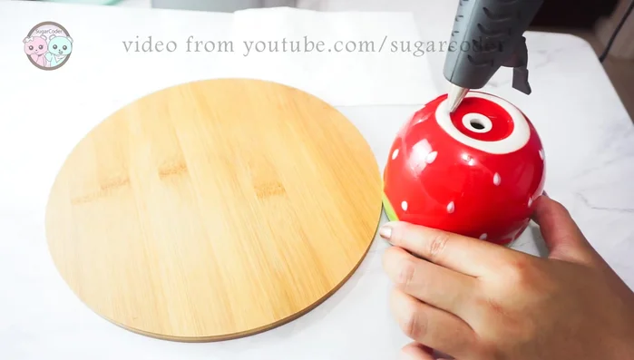 Flip the strawberry pot upside down.