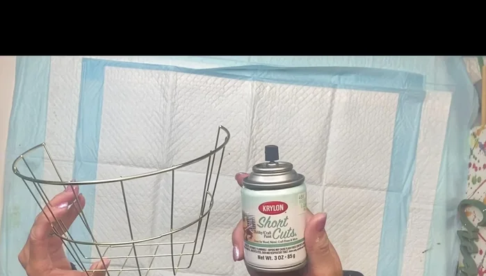 Paint the basket black with Krylon spray paint and let it dry.