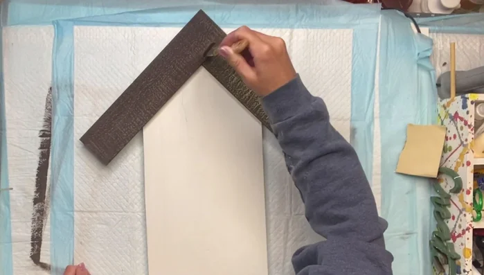 Distress the wood: Dry brush Wise Owl Goldenrod paint over the chocolate paint for a rustic look.