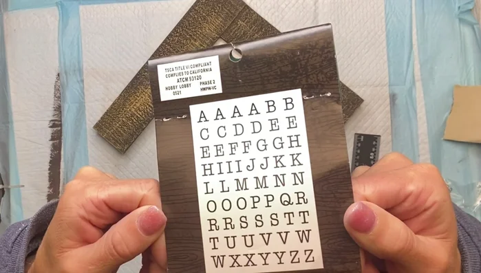 Attach the letters: Glue the laser-cut wood letters, spelling "Coffee House", using Elmer's wood glue and a small art brush for precise application.