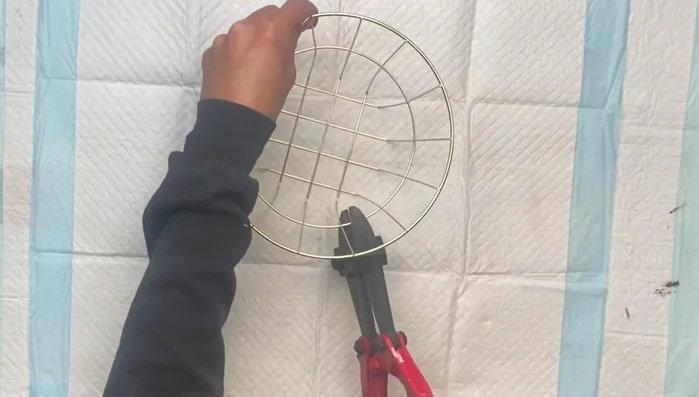 Paint the basket black with Krylon spray paint and let it dry.