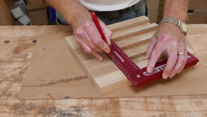 Clean up the edges after making the initial cuts: Use a chisel to remove the excess material created during the main slot cuts. This creates a shoulder for the next steps.