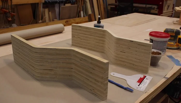 Sand the body with 80 grit then 120 grit sandpaper after gluing and filling any voids with joint compound.