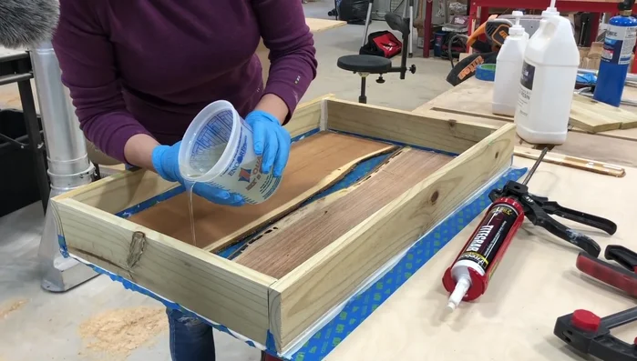 Sand the cured epoxy, starting with 80 grit and progressing to 3000 grit, followed by polishing.