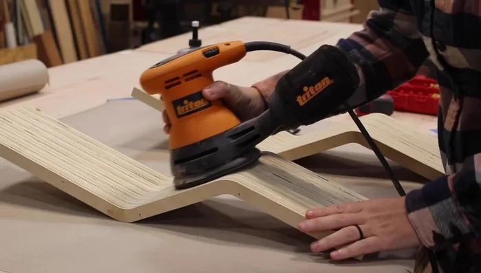 Sand the body with 80 grit then 120 grit sandpaper after gluing and filling any voids with joint compound.