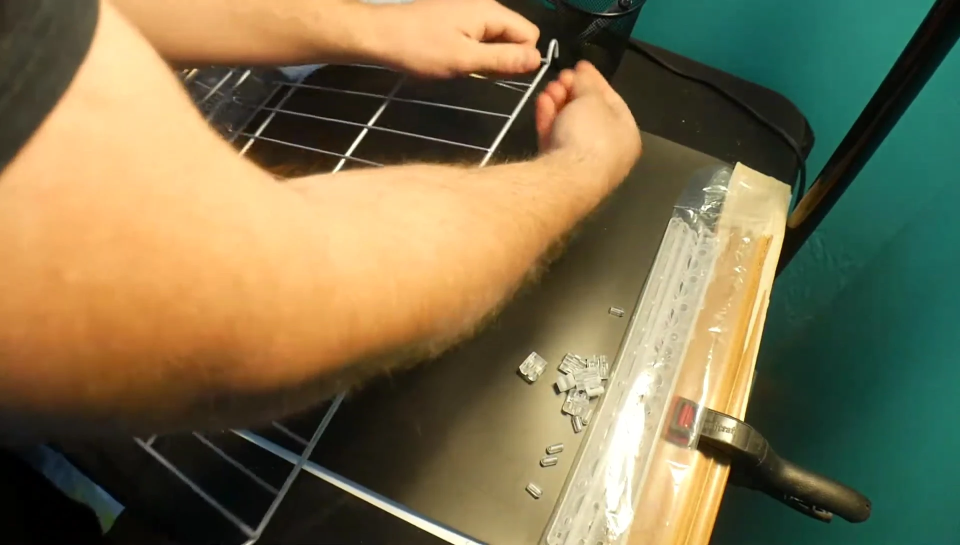 Close-up of the metal can rack being unboxed.