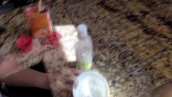 Scrub the paste gently on the bakeware.