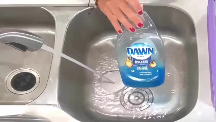 Submerge the silicone in the hot soapy water and allow it to soak for an hour.