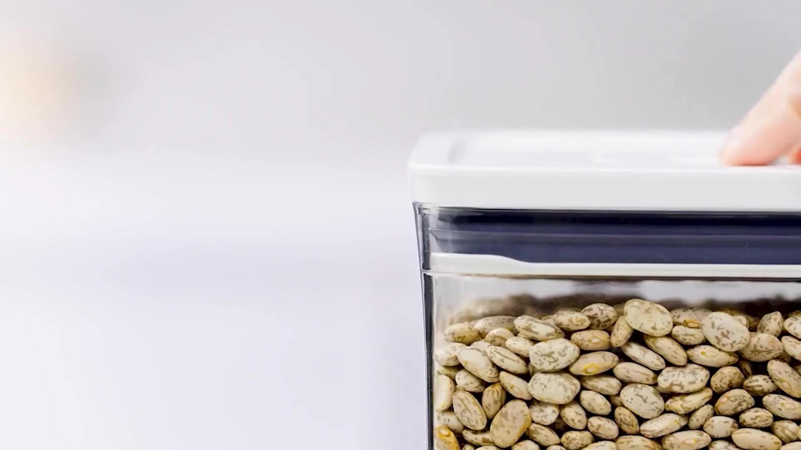 Close-up of an Oxo Pop container highlighting its lid and the included scoop.