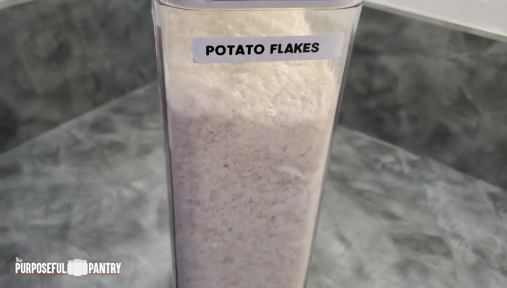 Decanting food into an OXO container.