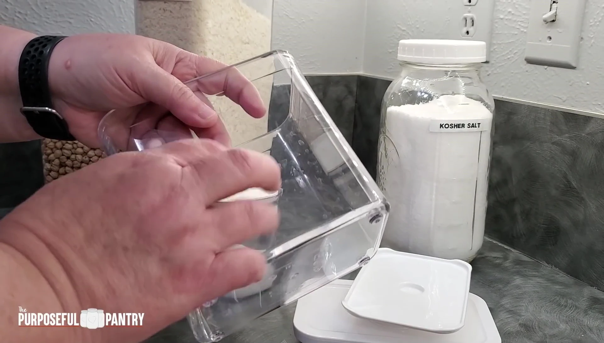 Close-up of an OXO container being disassembled for cleaning.