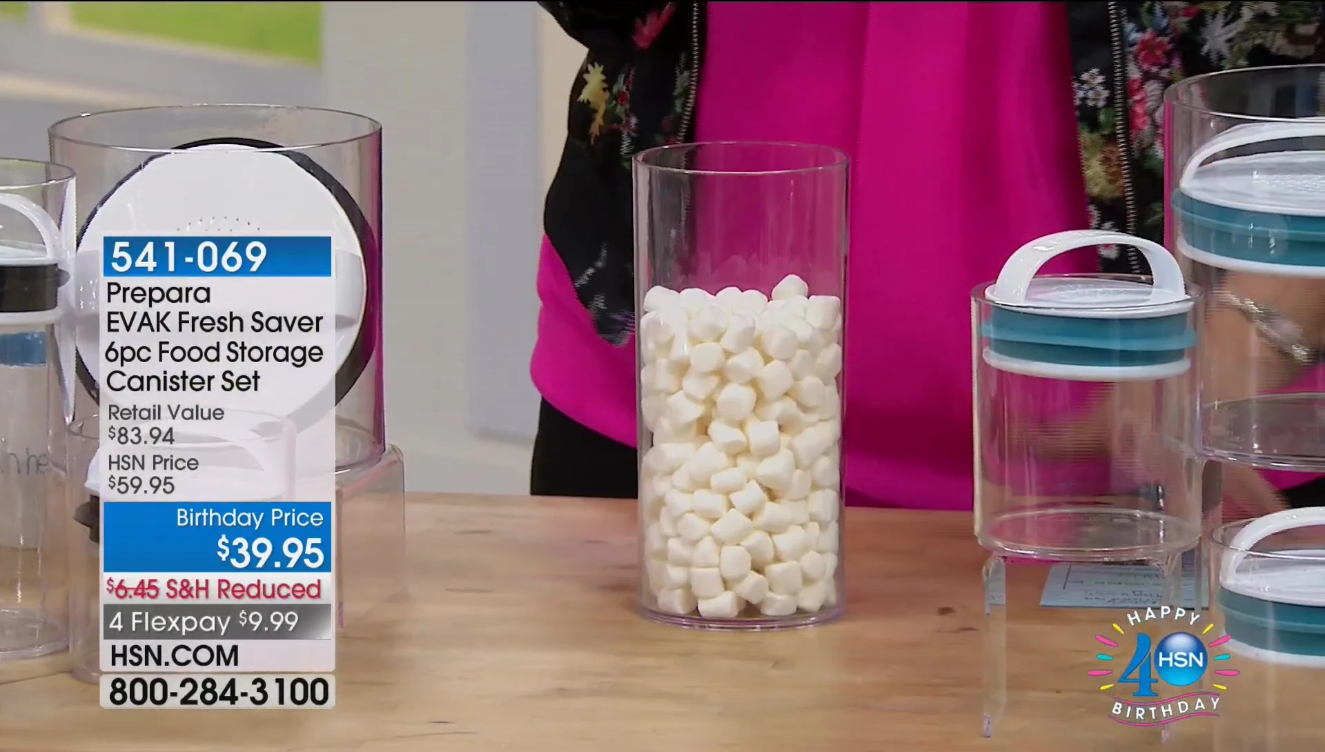 Presenter demonstrating the air-removal mechanism on a canister lid.