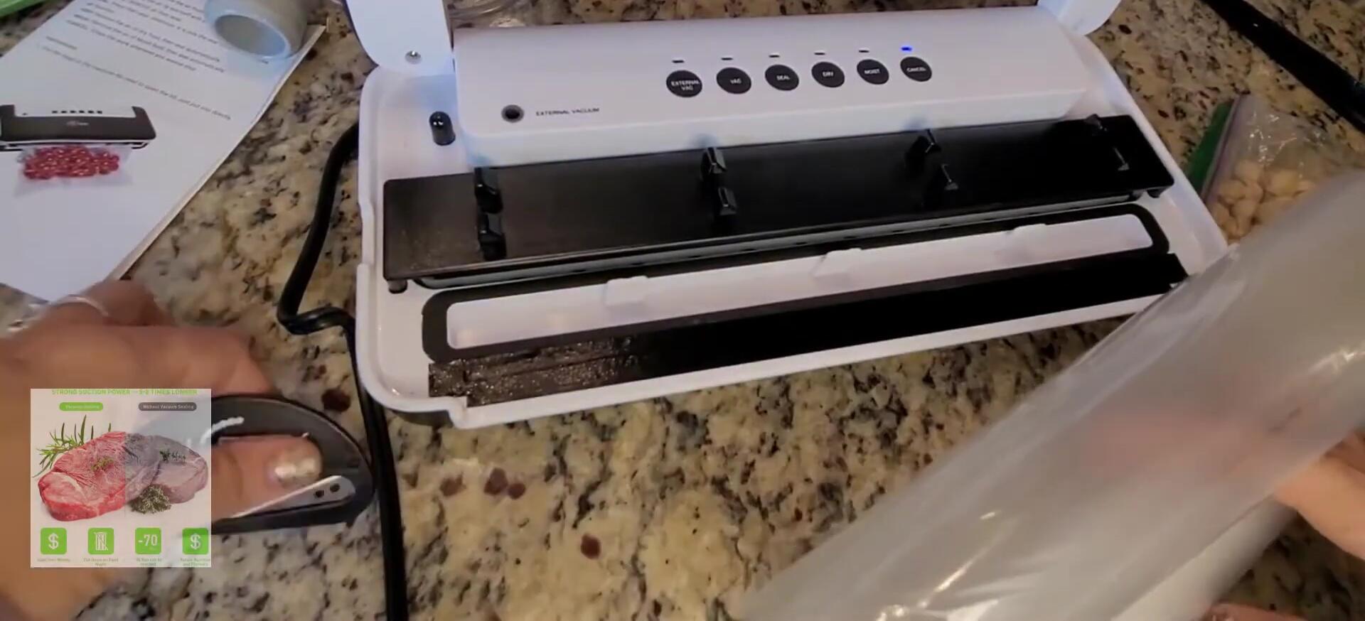 Using the built-in cutters to trim the bag.