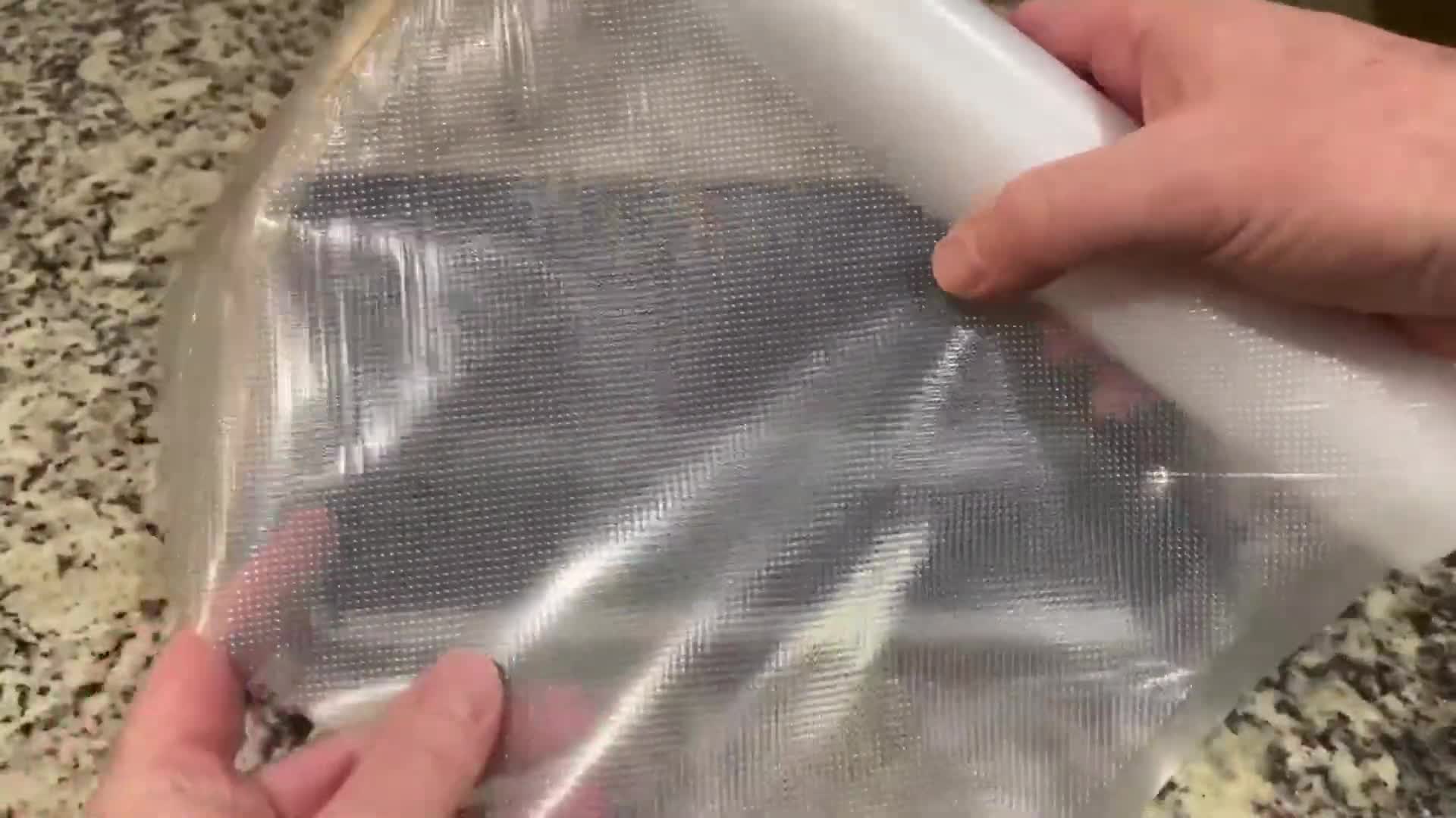 A roll of Wevac vacuum sealer bags being unrolled