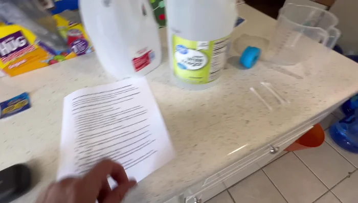 Attach the cleaning bottle to the dispenser, plug in the power cord, and turn the dispenser back on. Allow the cleaning solution to fill the reservoirs.