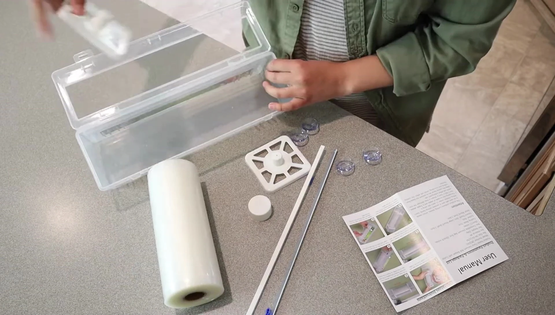 The 8-inch bag roll being loaded into the keeper.