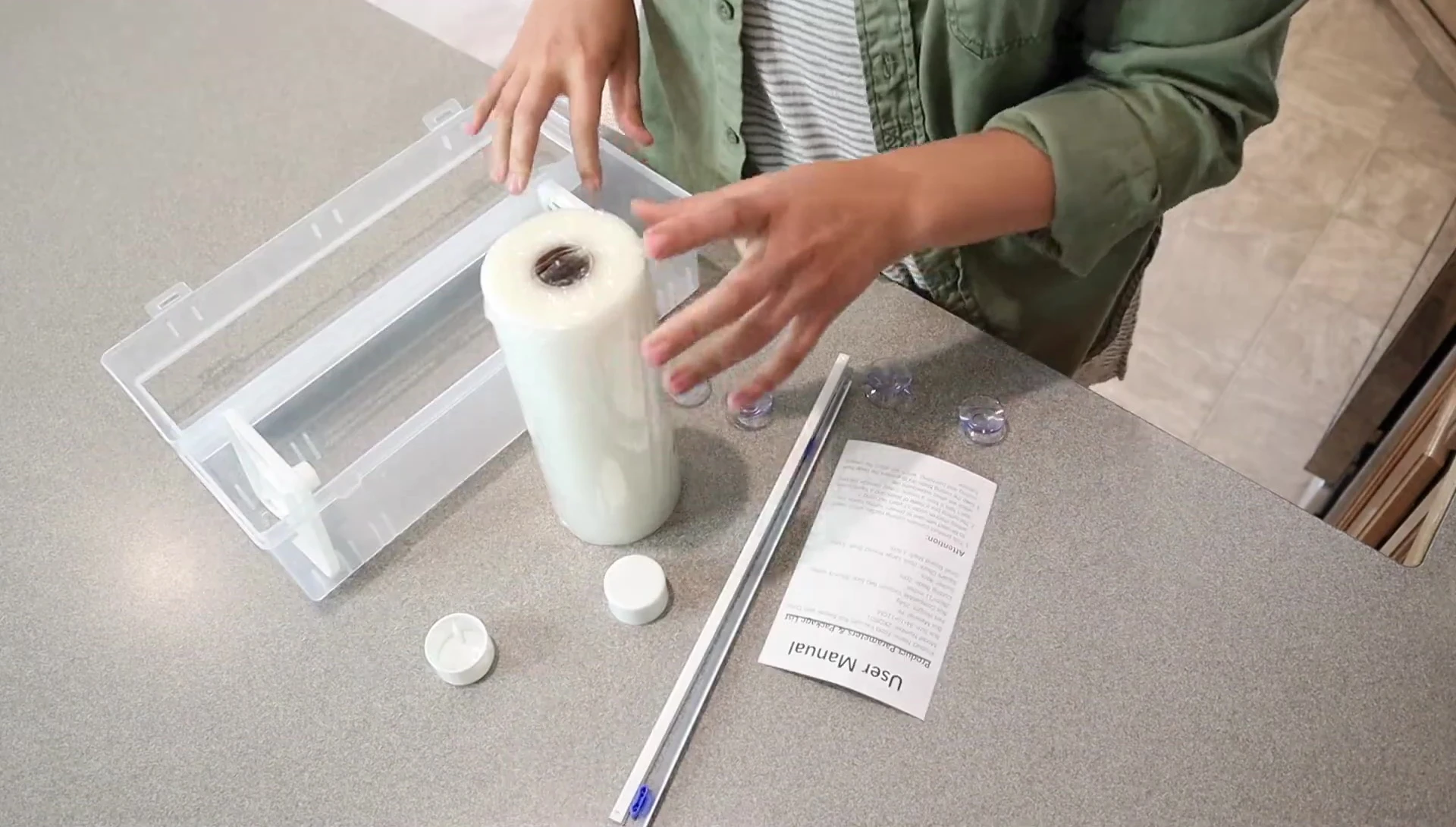 Close-up of all components included with the vacuum seal roll keeper.