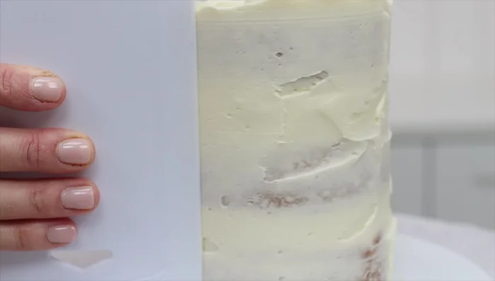 Apply the final layer of frosting after the cake has thawed slightly. This allows for smoother and more precise frosting.