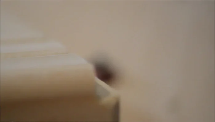 Apply paraffin wax to the edges of the tambour for smoother sliding.