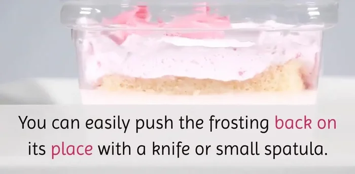 Gently push frosting back into place if needed using a knife or spatula.