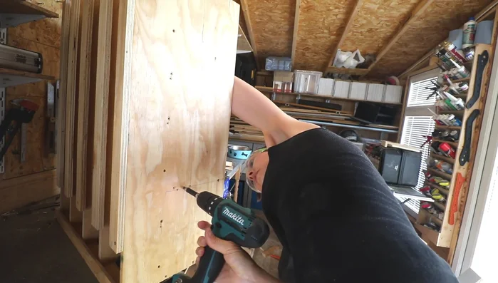 Screw the shelf into the frame, potentially adjusting the height as needed. The final placement prevents interference with the dog's bowl.