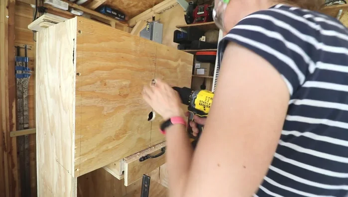 Create a dog-bone shaped opening on the front cover for visibility and a cleaner aesthetic.