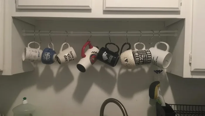 Use an over-the-door organizer on cabinets for storing flat items.