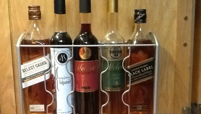 Use an over-the-door organizer on cabinets for storing flat items.