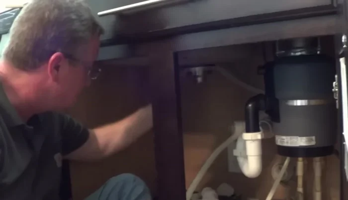 Tighten the nut securely, forcing out any remaining excess putty. Wipe off excess putty.