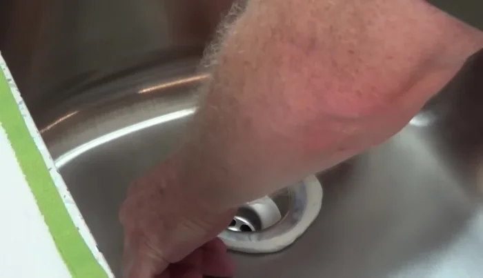 Wipe off excess putty from the top.